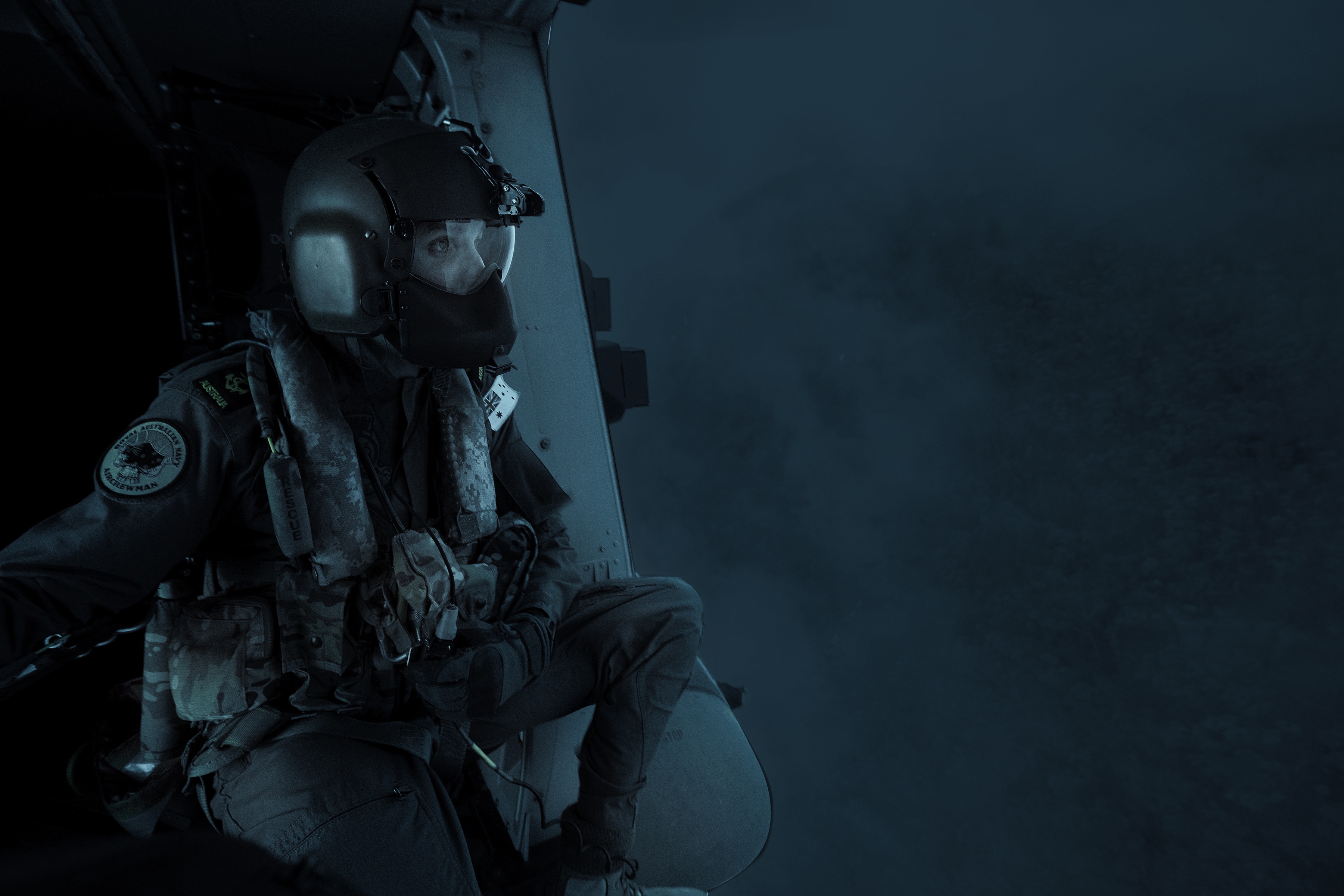 HMAS Albatross Support - NSW State of Emergency Royal Australian Navy Aircrewman Leading Seaman Ben Nixon of 808 Squadron, assesses the Tianjara Fire in the Moreton and Jerrawangala National Parks out of an MRH90 Taipan Military Support Helicopter.